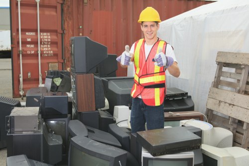 Business waste removal professionals clearing an office space.